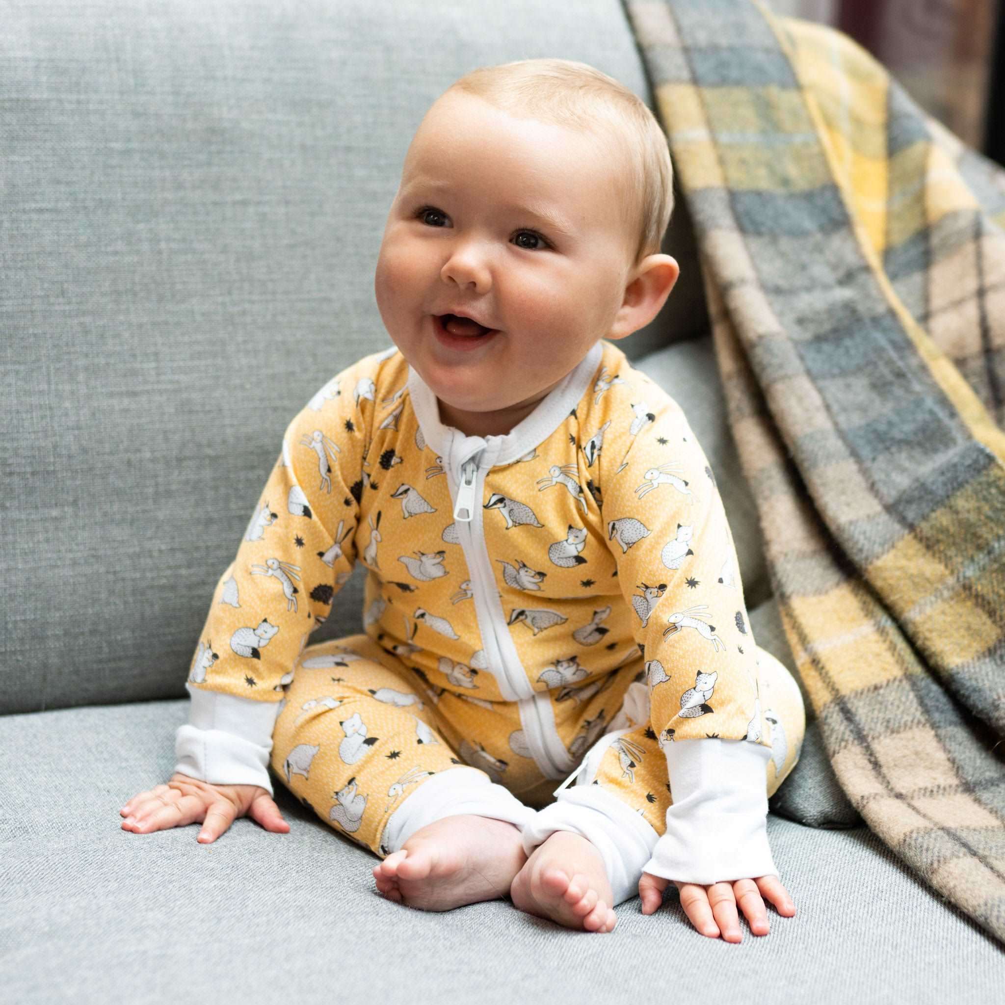 The Furry Forest Friends ZippySuit. The perfect baby grow has a 2-way zip for quick and easy changes, foldable mitts and foldable feet pouches.